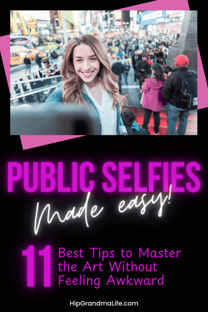 Smiling young woman taking a selfie in Times Square with a busy city crowd behind her.