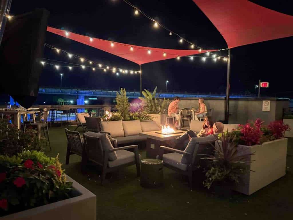 Rooftop Seating around a cozy fire at Hotel Indigo