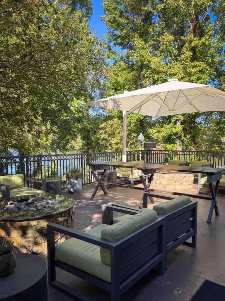 Outside patio seating with umbrella and comfortable chairs