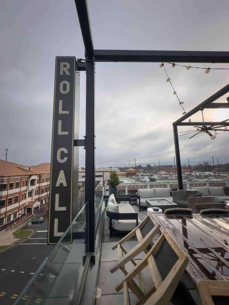 The rooftop view from Roll Call showing the sign overlooking the town