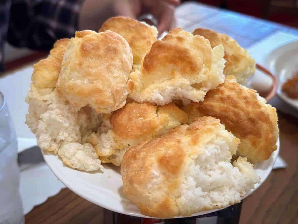 Fluffy homemade fried biscuits served on a white plate, perfect for breakfast or brunch, showcasing Southern comfort food and delicious, golden-brown crusts.