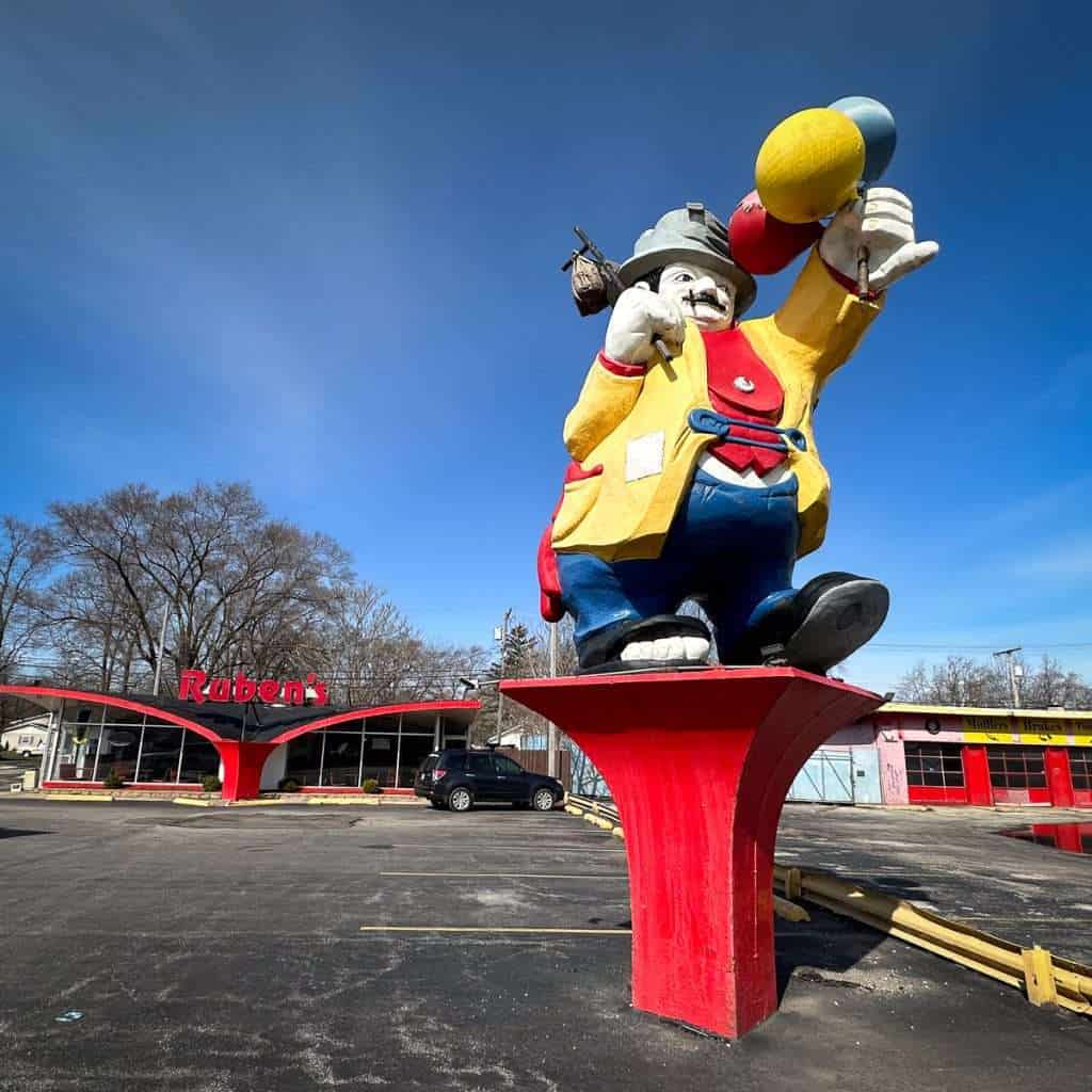 Ruben’s Giant Hobo statue towering over a parking lot in Lake Station, Indiana, a classic quirky roadside attraction