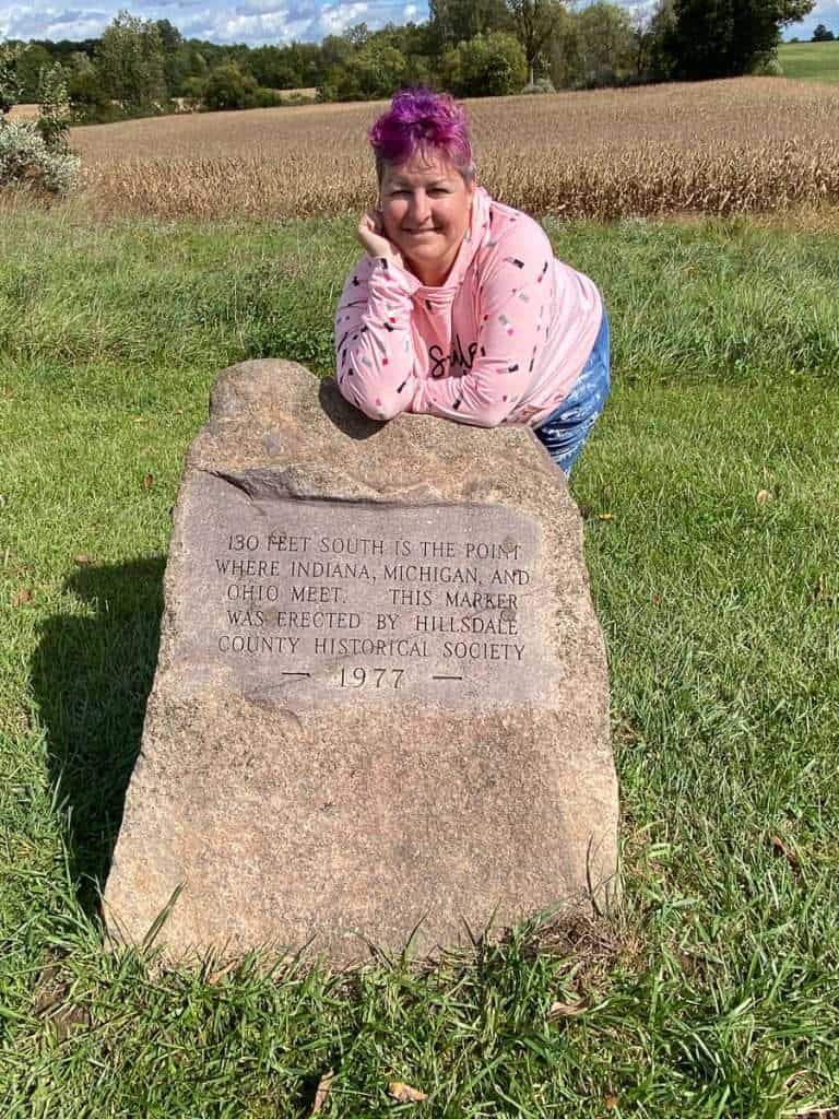 Three States Marker near Fremont, Indiana, where Indiana, Michigan, and Ohio meet on a rural roadside