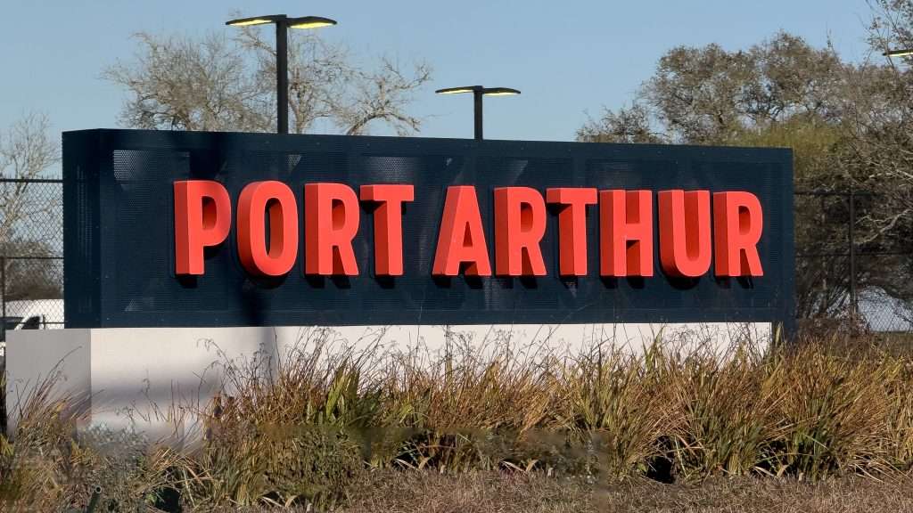 Port Arthur Texas city sign with large red letters marking the Cajun Capital of Texas