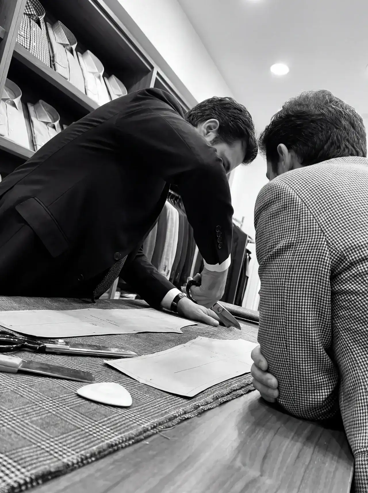 Two professionals collaborating on fabric samples at H.M. Cole store.