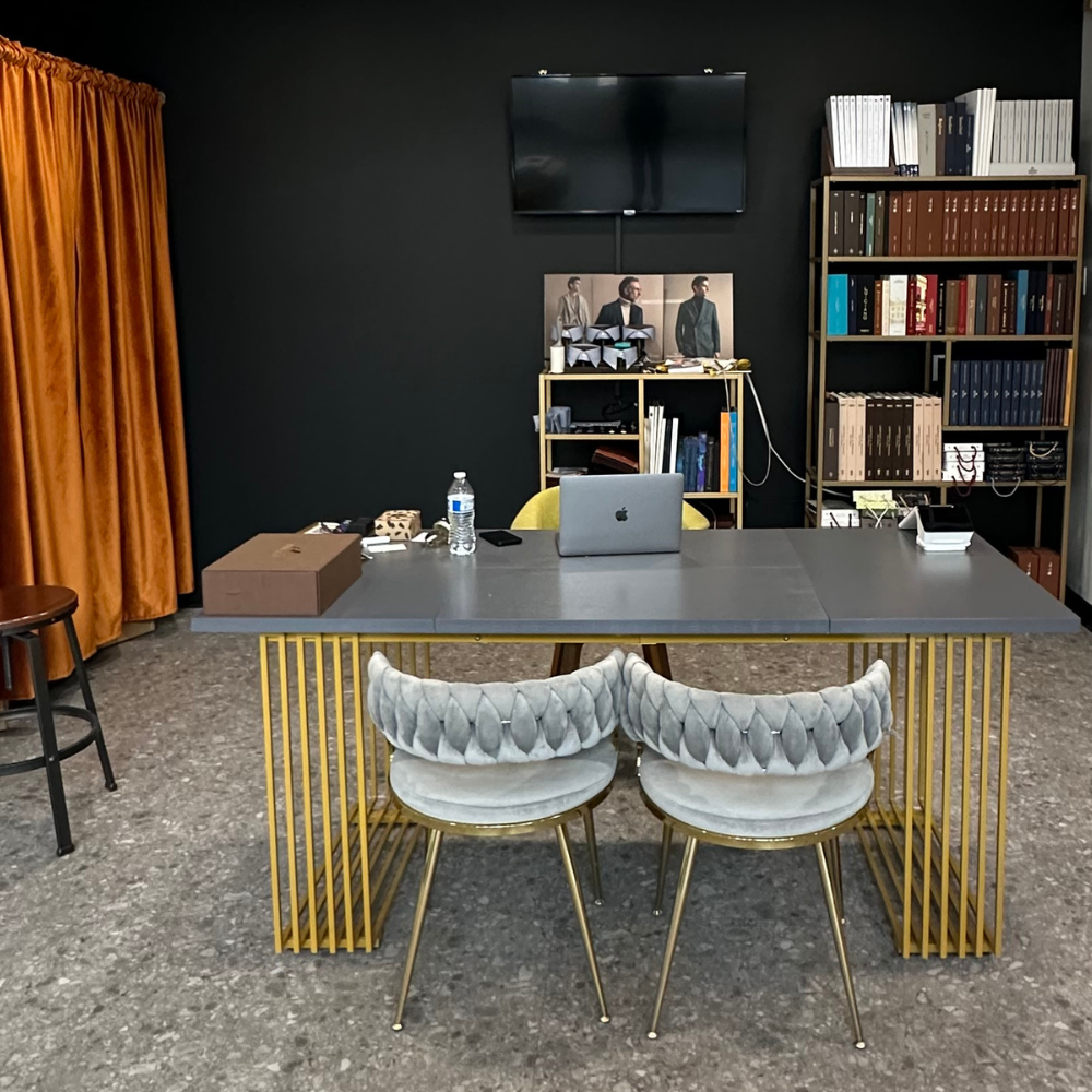 Modern office meeting room with table, chairs, and media setup in Denver, CO.