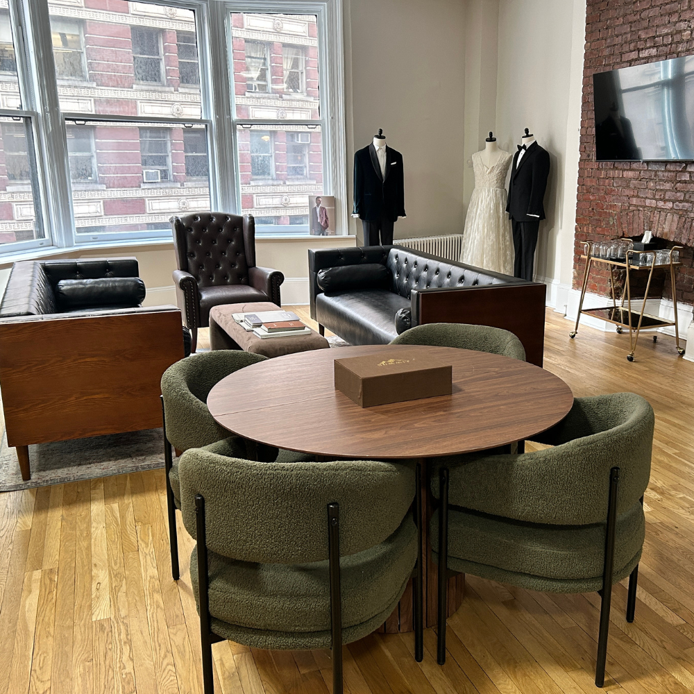 Modern office meeting space with seating and decor.