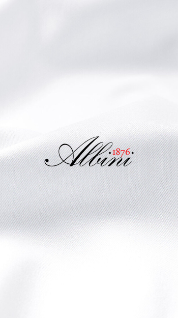 Alvini 1876 fabric logo on white textile background.
