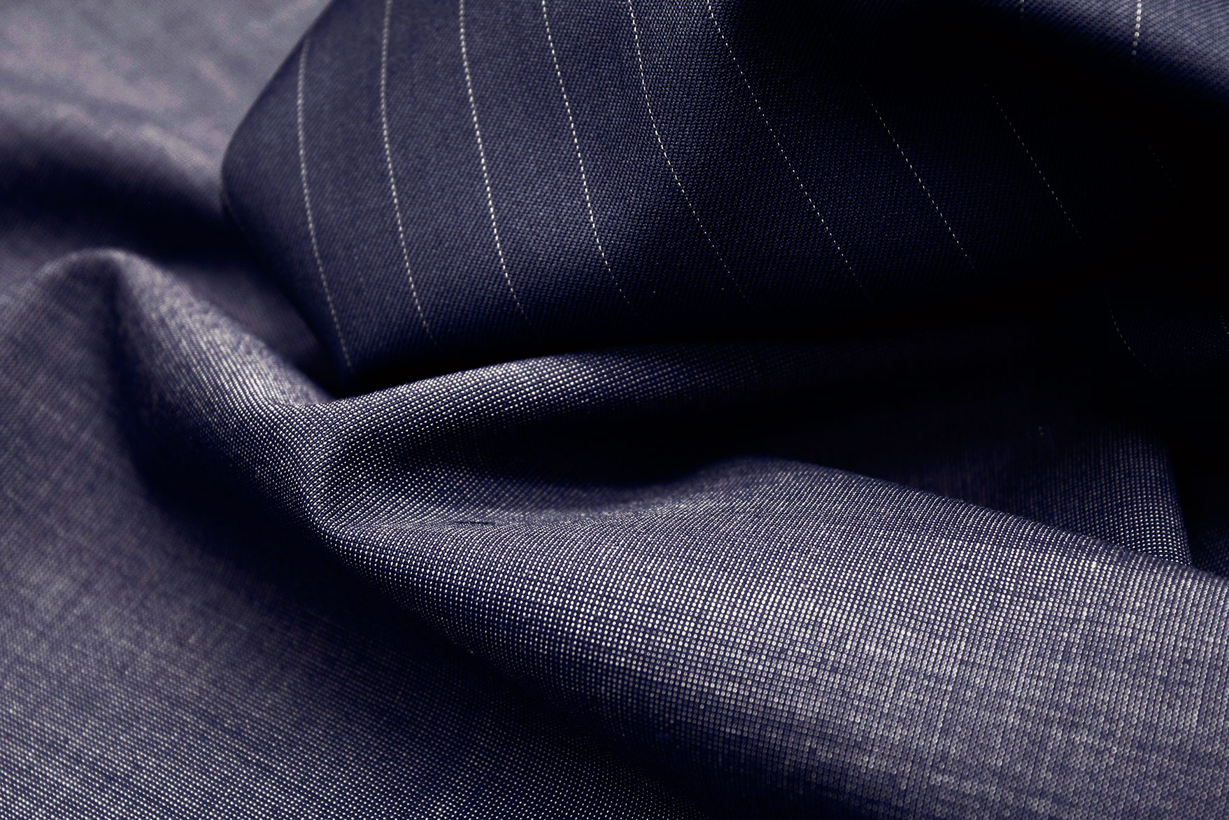 Pinstripe wool fabric for tailored suits and professional apparel.
