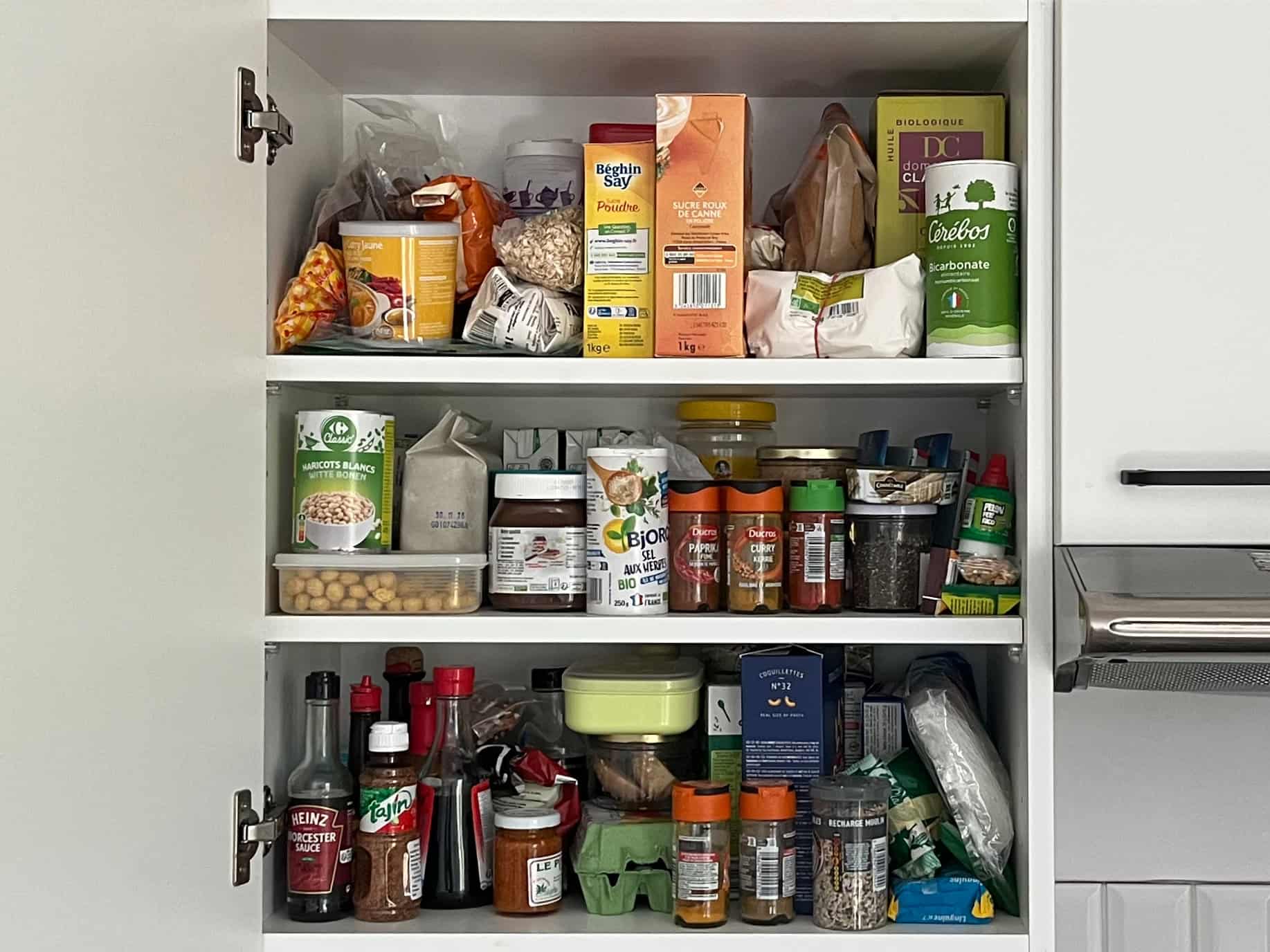 Before: Messy, overstuffed pantry cabinet