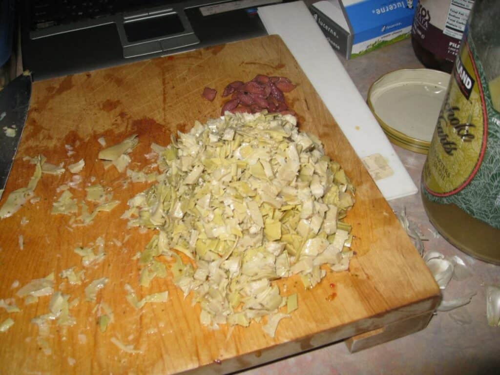 Image shows chopped artichokes.