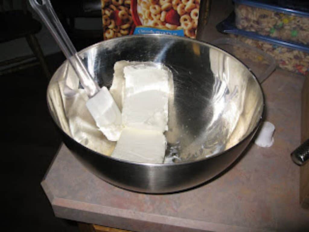 Image shows cream cheese in a bowl.