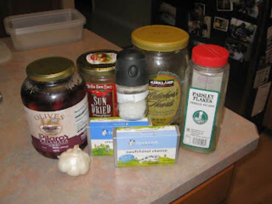 Image shows Ingredients for Tuscan artichoke and sundried tomato dip.