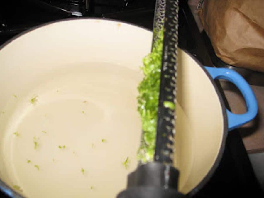 Image shows lime zested directly into saucepan.
