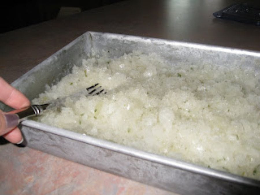 Image shows mojito granita frozen and fluffy.