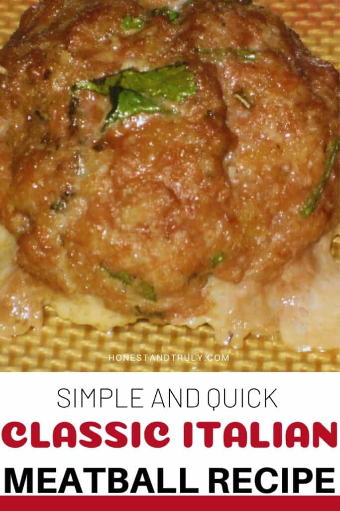 Image shows close-up picture of classic Italian meatball.