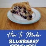 Head on shot of blueberry streusel coffee cake on a plate.