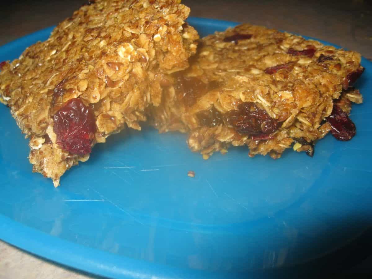 Image shows baked granola bars on a plate.