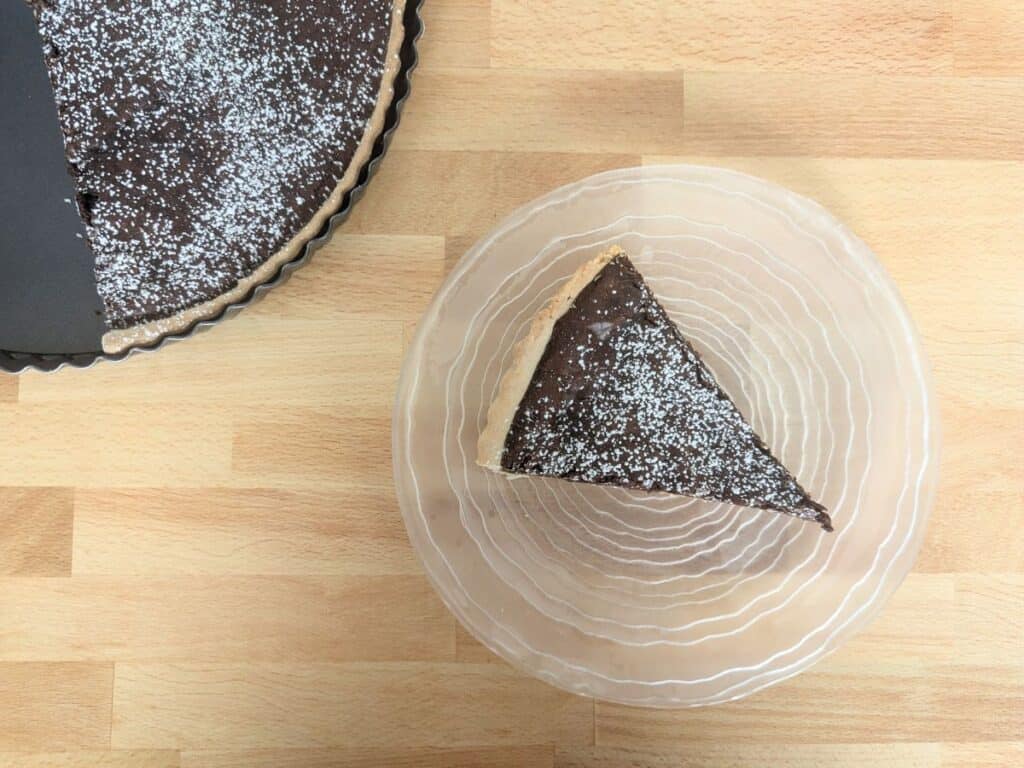 Image shows chocolate and caramel tart.