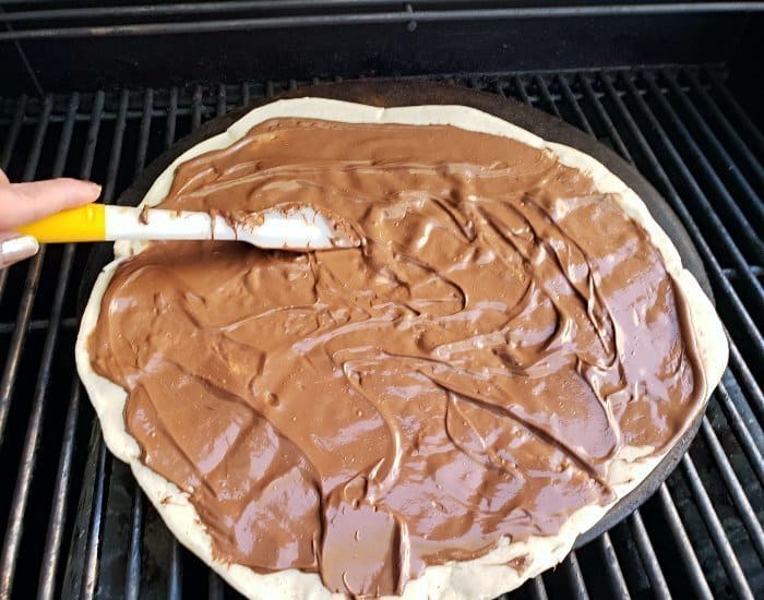 Spread Nutella on pizza