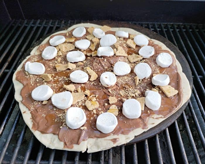 Top dessert pizza with marshmallows