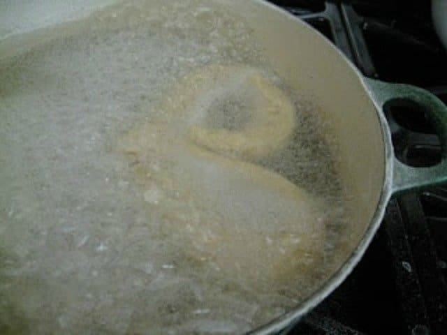 Boil pretzels in baking soda water before baking