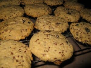 Image shows batch of cookies on a baking sheet.