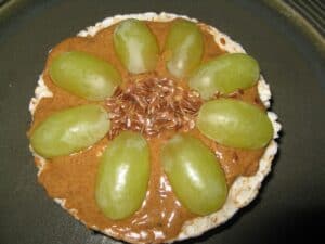 Image shows close-up picture of flowers rice cake snack.