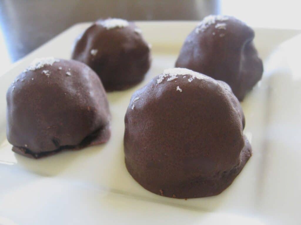 Image shows perfect truffles on a plate.