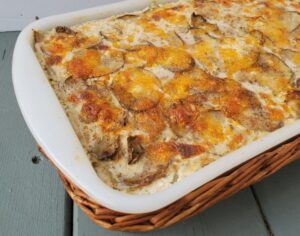 Close up of baked cheesy scalloped potatoes in the pan