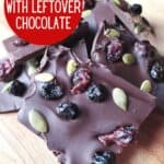 Head on of chocolate bark on wooden background with text what to do with leftover chocolate.