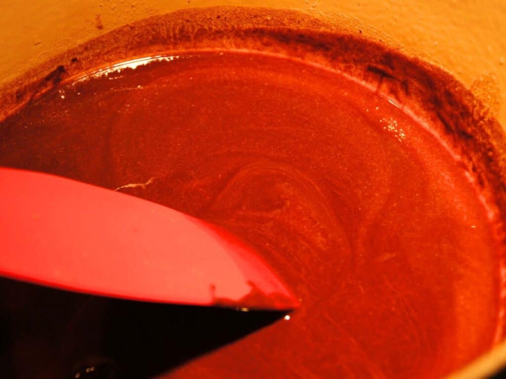 Image shows butter and chocolate mixed together.