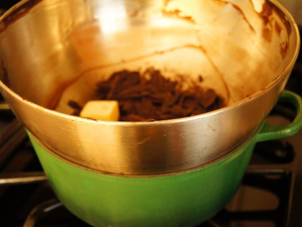 Image shows chocolate and butter in a double boiler.