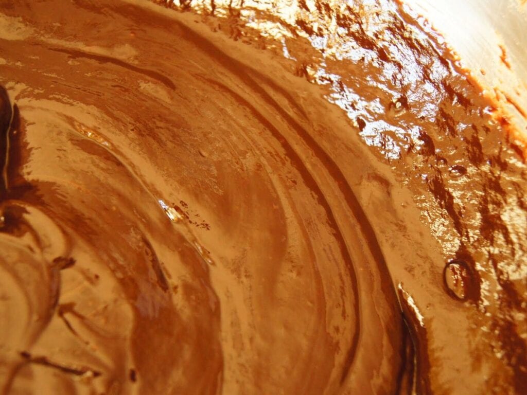 Image shows melted chocolate, butter, and cream smoothly.