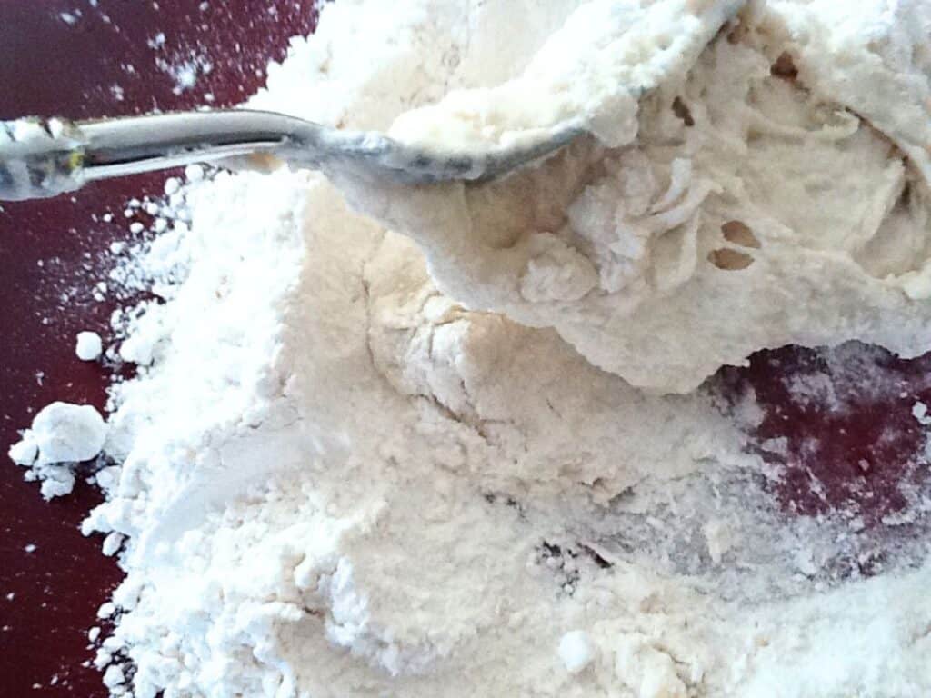 Image shows combining all the ingredients using a fork.