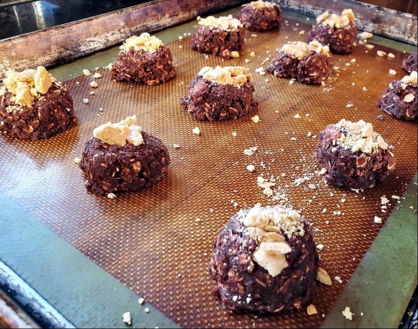 Graham crackers on top of cookie dough balls