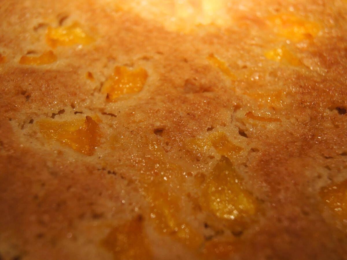 Image shows a close-up picture of peach cake.