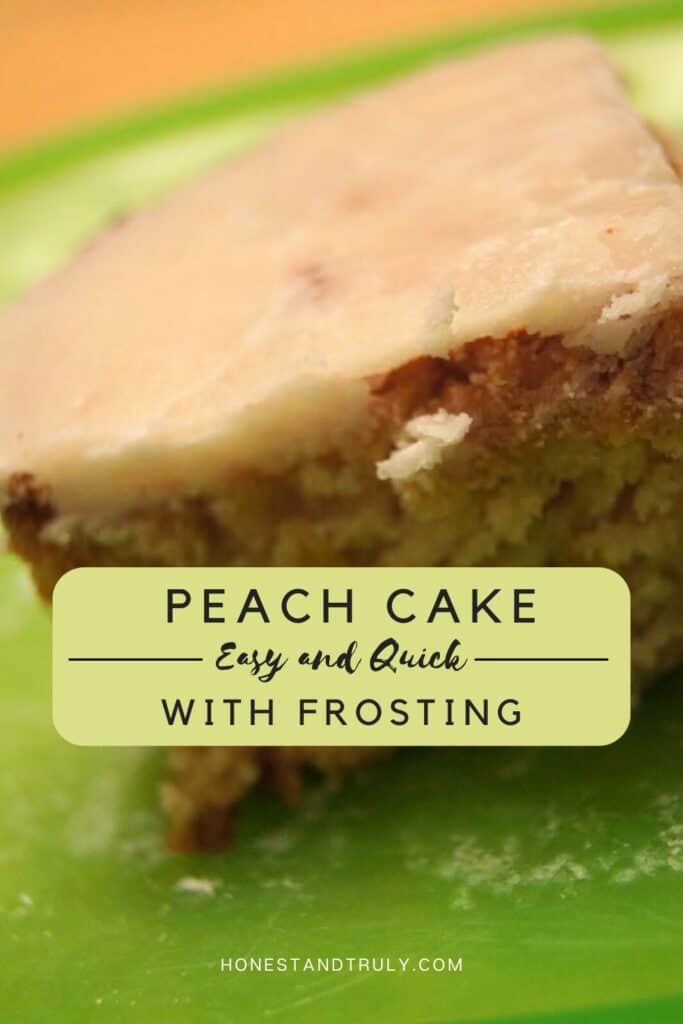 Image shows close-up picture of peach cake with frosting.