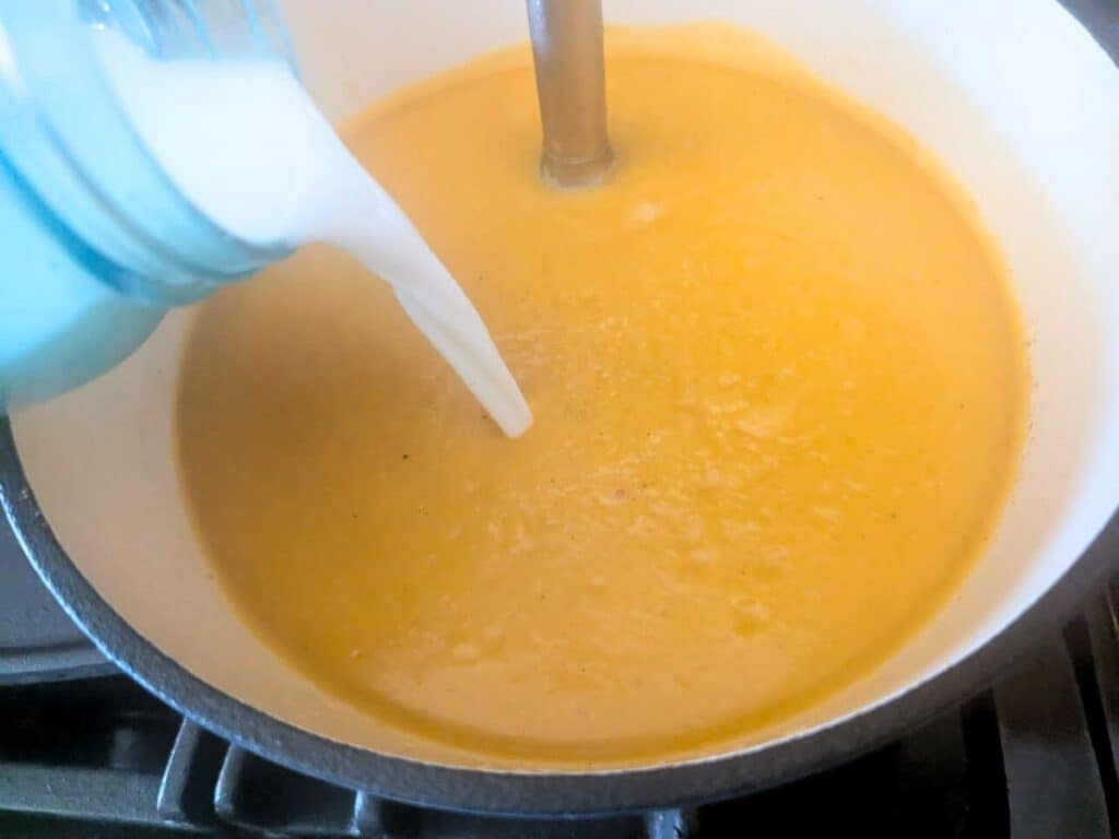 Image shows adding milk to the pot.