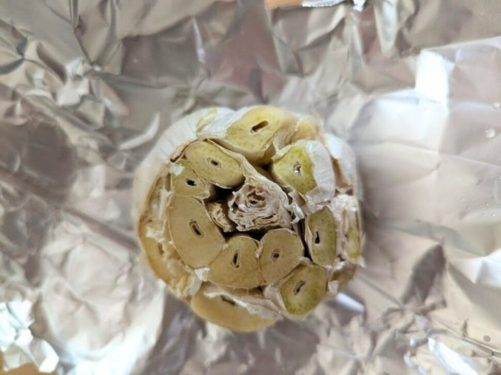 Image shows ready to be roasted garlic.