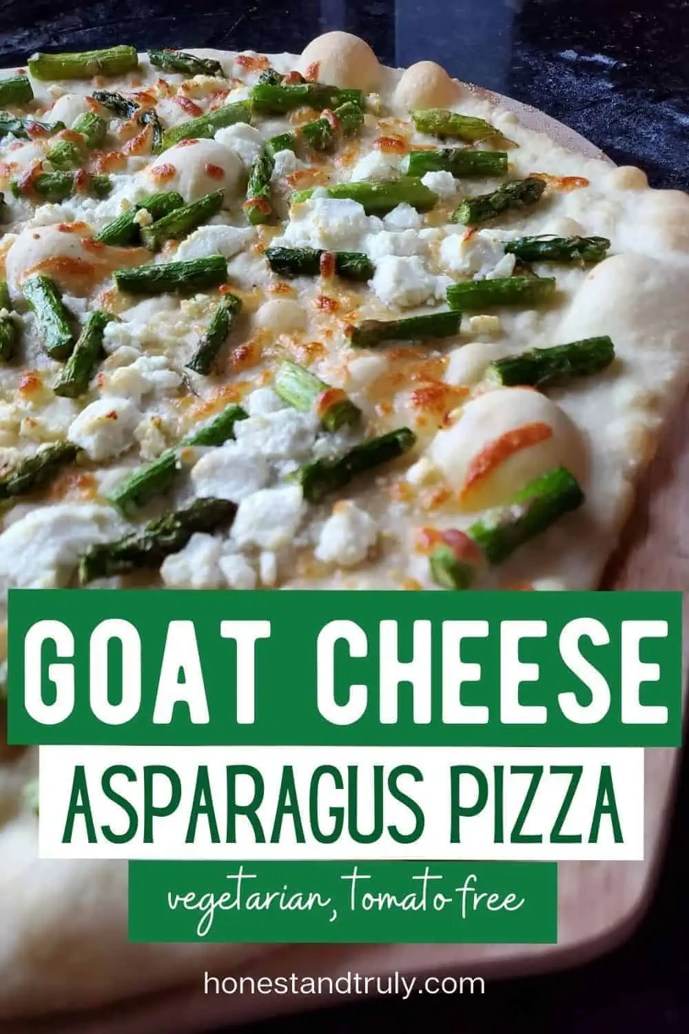 Close up shot of a whole baked Asapargus goat cheese pizza.
