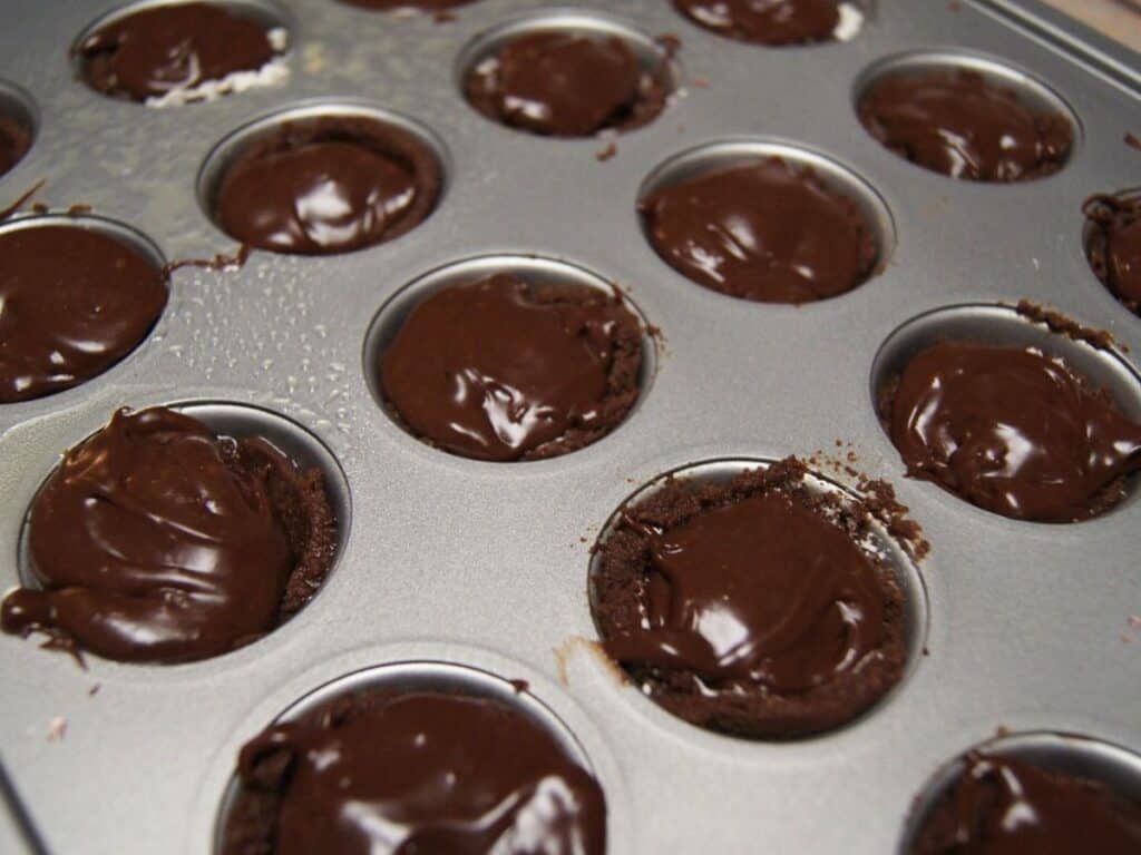 Image shows cherry bliss bites filled with chocolate filling.