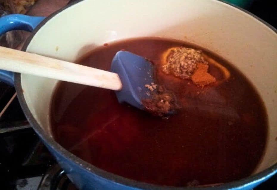 Image shows homemade BBQ sauce ingredients in a saucepan.
