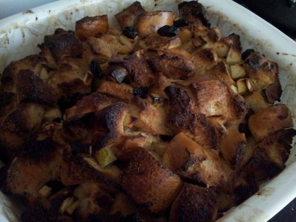 Image shows baked bread pudding.