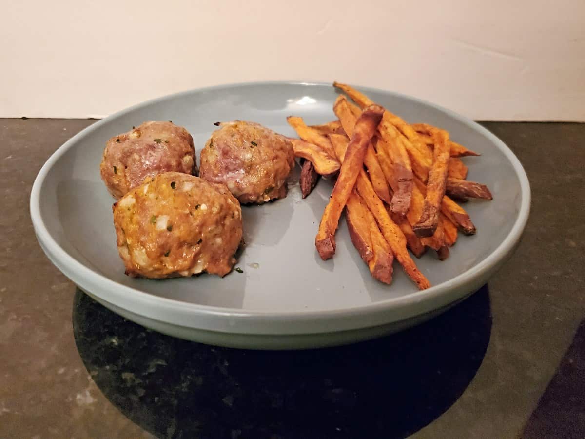 Plate of sweet potato meatballs with sweet potato fries.