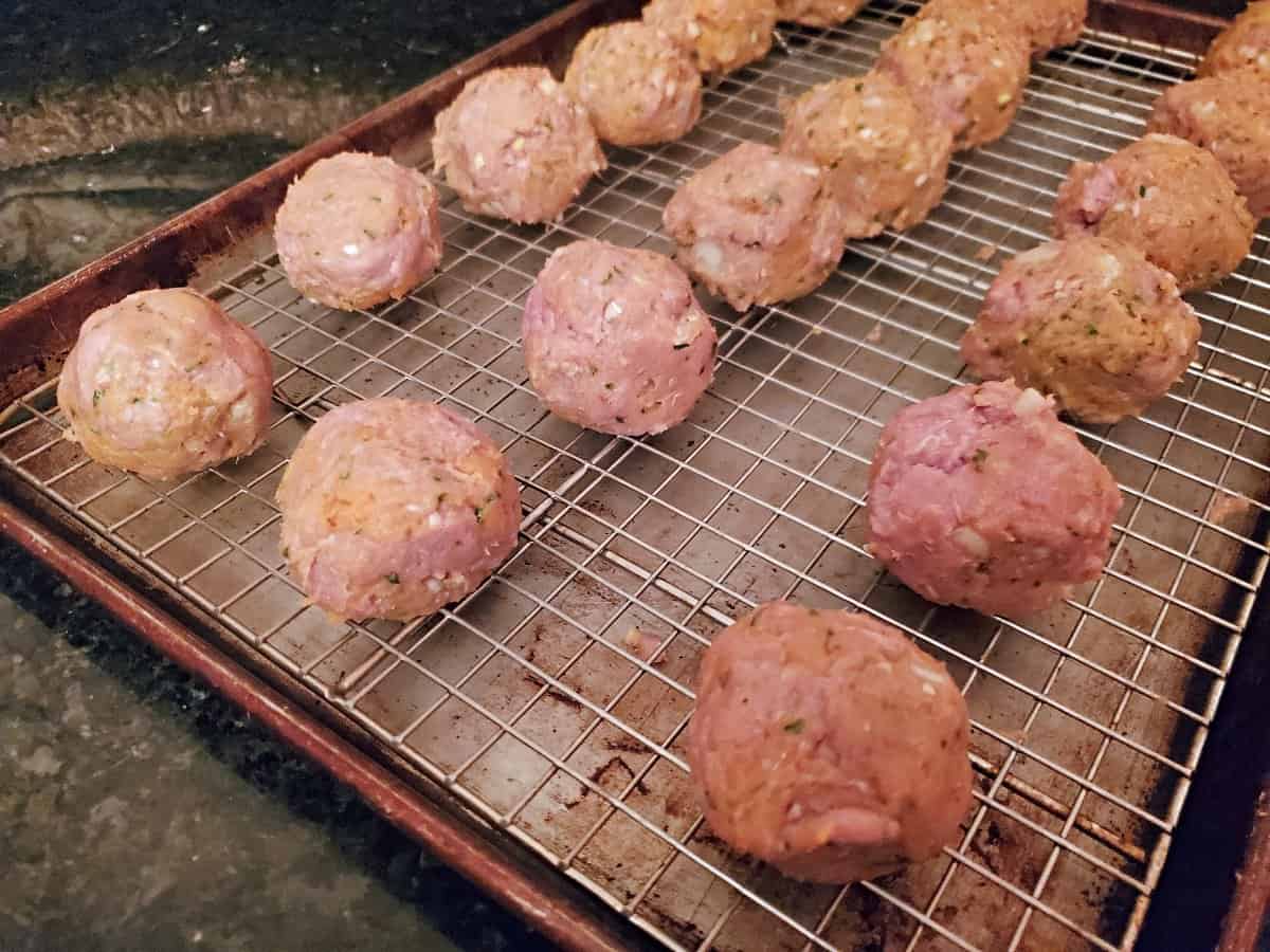 Sweet potato turkey meatballs on a rack ready to bake.