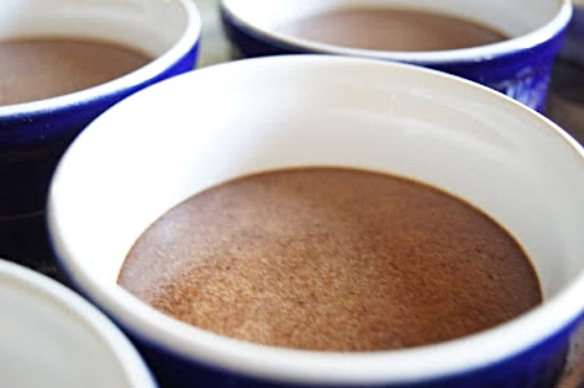 Closeup of chocolate pots de creme in ramekins.