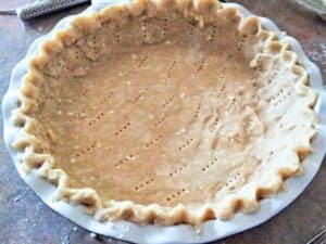 Image shows unbaked pie crust.