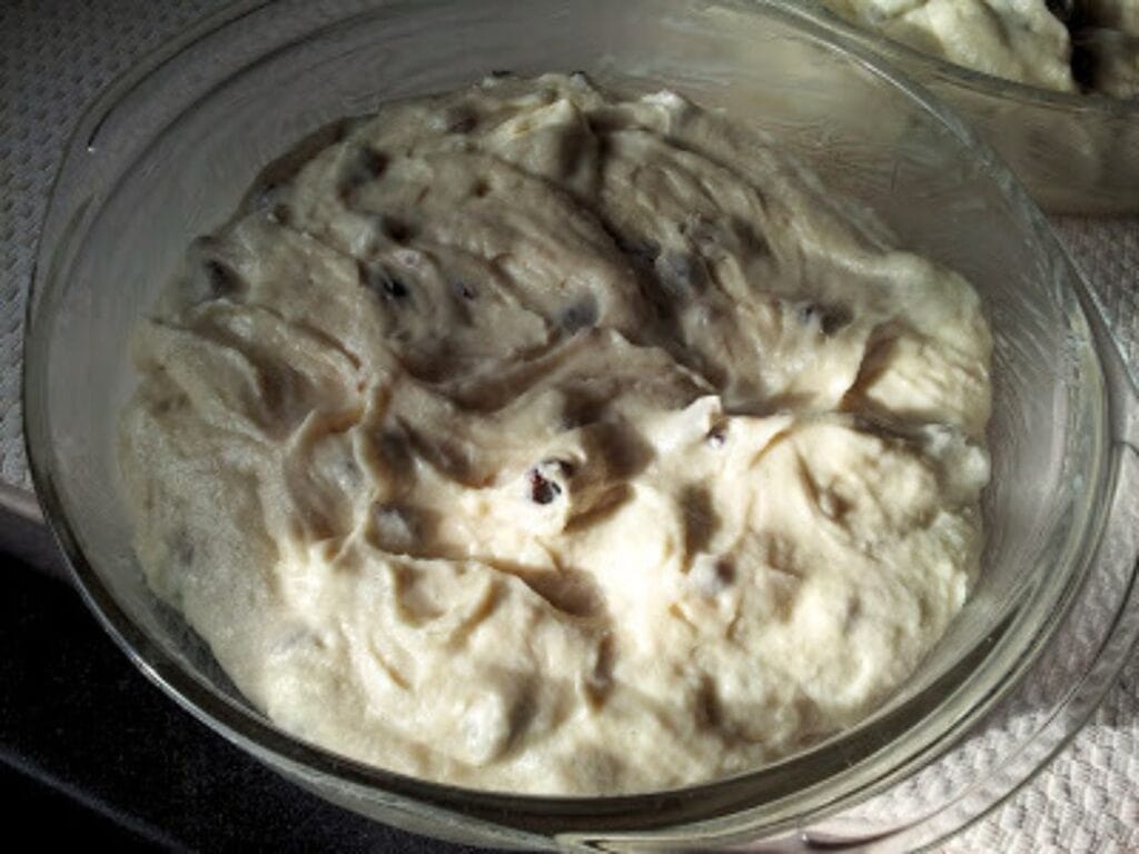Image shows cake mixture in a glass mixing bowl.