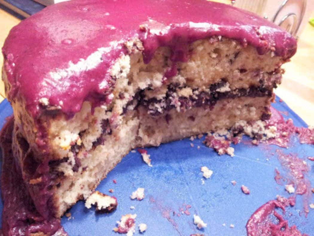 Image shows sliced cherry cake.
